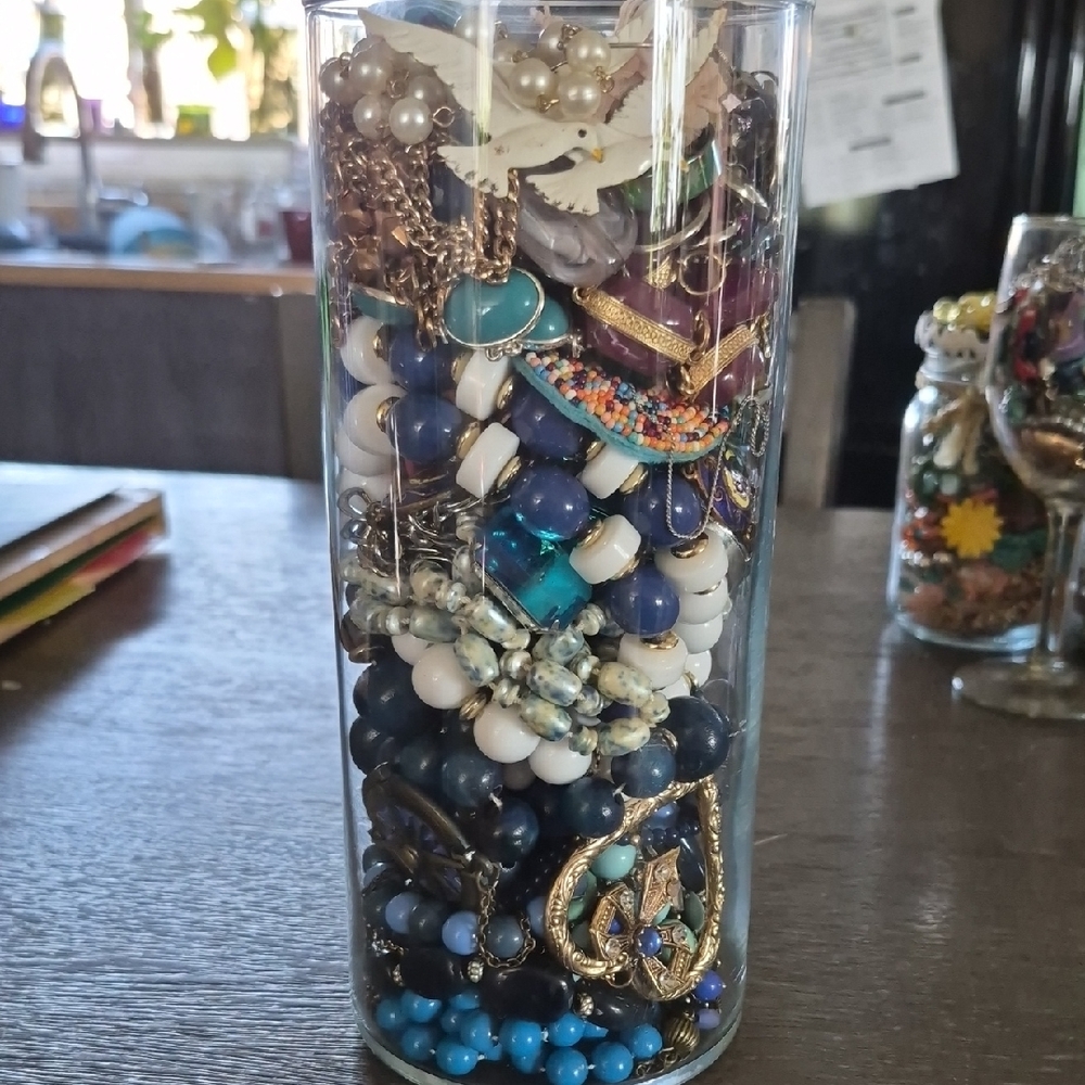 Assorted Jewelry in Glass Vase
